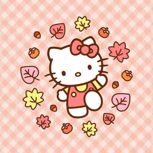 Avatar Hello Kitty mặc áo len vàng đứng giữa vòng hoa lá