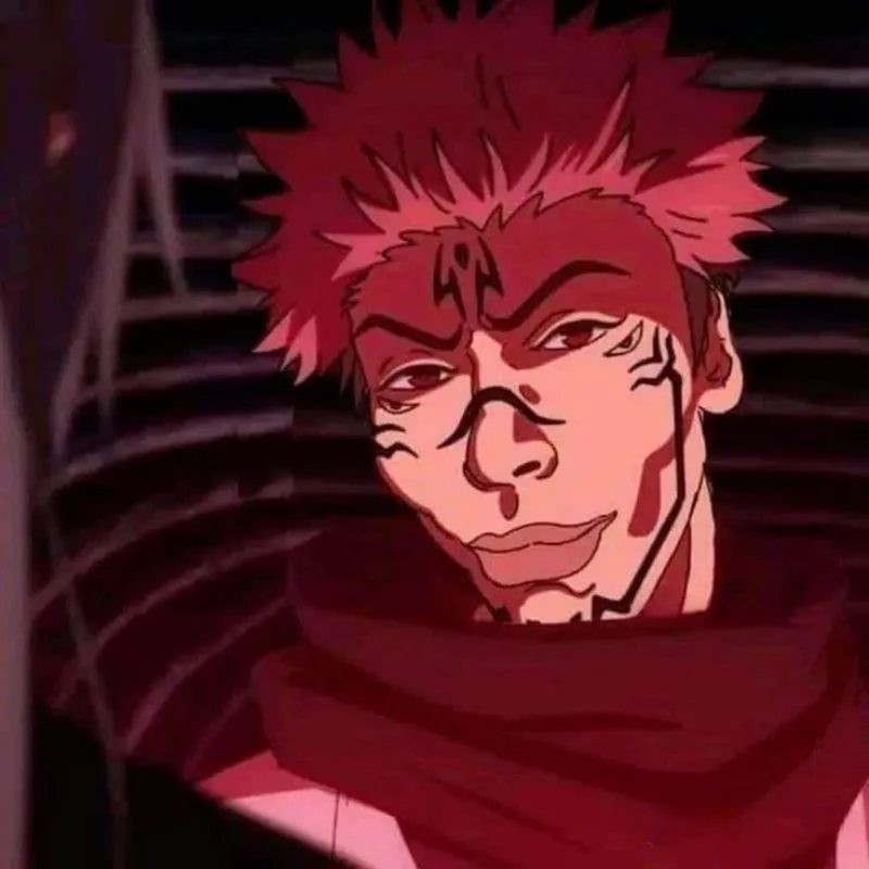 Ảnh minh họa Sukuna từ Jujutsu Kaisen với biểu cảm tự mãn, nụ cười đầy ẩn ý và quai hàm cường điệu, nền đỏ